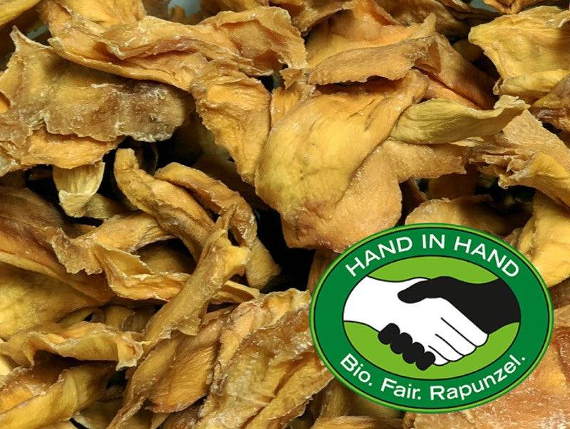 Bio-Mangostreifen Fair HIH Rapunzel – Erhältlich bei Kornkiste, der nachhaltigen Unverpackt-Online-Foodcoop. Bio, plastikfrei und ökologisch verpackt im praktischen Mehrweg-Großgebinde. Lose und ressourcenschonend für gemeinschaftliches, bewusstes Einkaufen. Jetzt online bestellen!